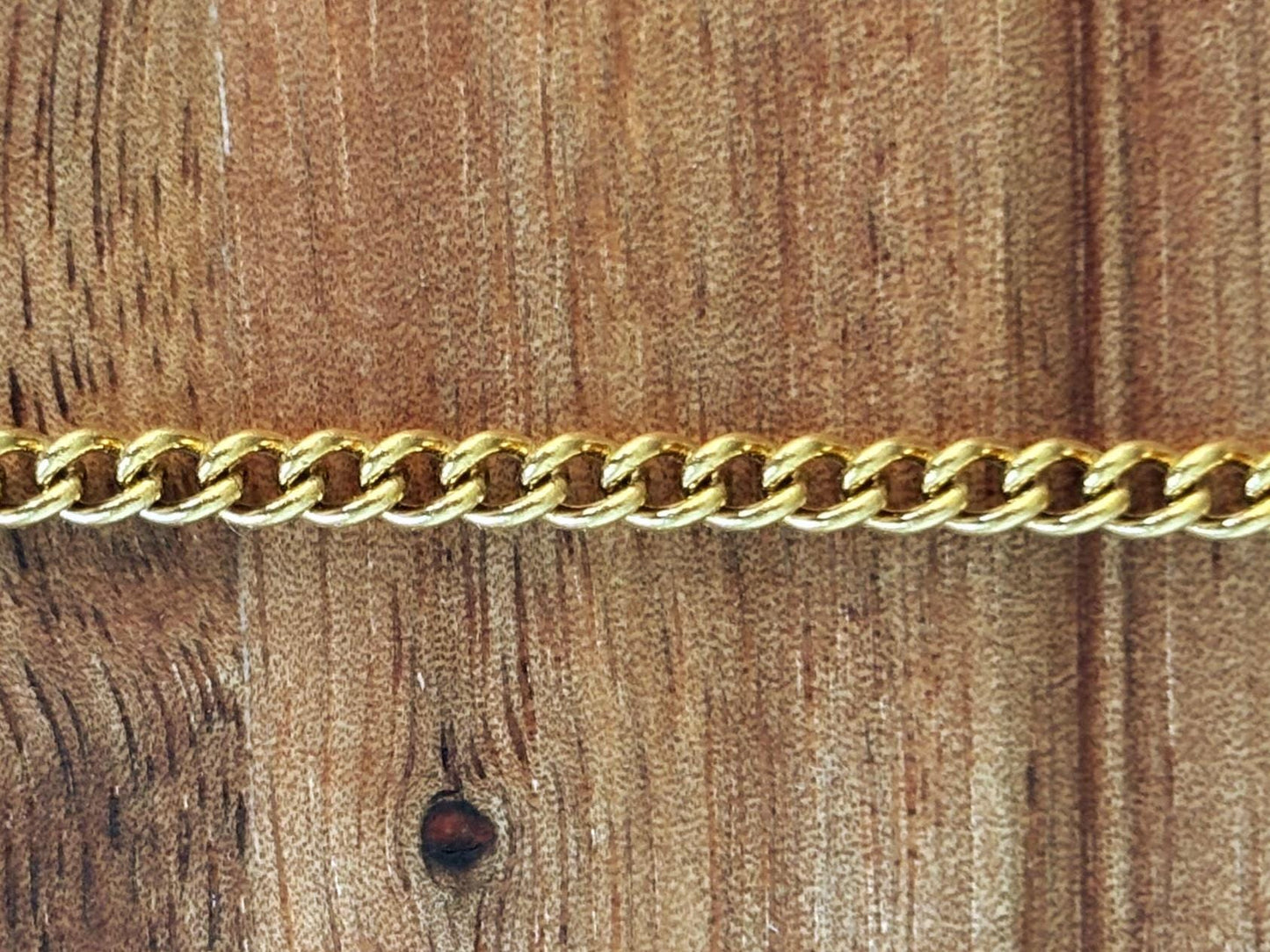 Curb chain non-tarnish gold 4 mm x 3 mm stainless steel sold by the foot