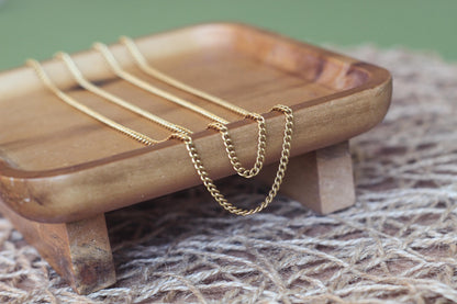Curb chain non-tarnish gold 4 mm x 3 mm stainless steel sold by the foot